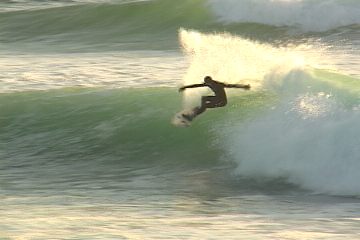 Twist your upper body in the direction you are turning, and extend your leading arm